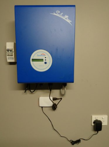 Our inverter (blue box) with the Raspberry Pi attached (the little white box).