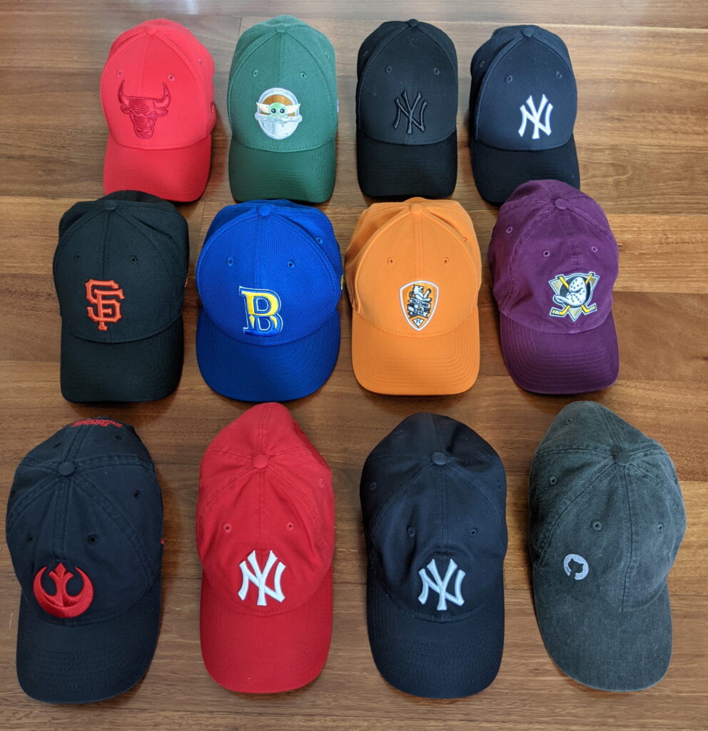 An array of baseball hats that I own